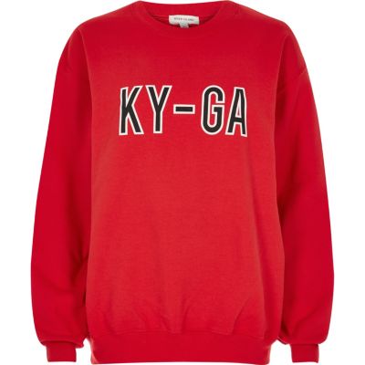 red slogan jumper